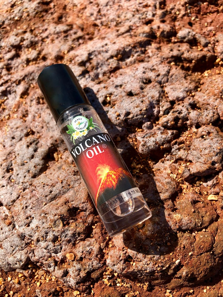 Volcano Oil Roll-On laying diagonally on a red rock.